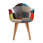 Bring a perfect blend of mid-century style and modern comfort to your indoor or outdoor space with the Arm Rest Patch Garden Eames Chair. Inspired by the iconic Eames design, this chair features a molded polypropylene seat in a vibrant patchwork fabric finish, combined with ergonomic armrests and a contoured shape for all-day comfort. The colorful, eye-catching upholstery adds a unique artistic flair, making it a standout piece in any setting—be it your garden, patio, balcony, living room, or office. Built on solid wooden legs reinforced with a black steel Eiffel-style base, this Eames-style armchair offers both stability and style. The supportive armrests and cushioned seat make it ideal for relaxing, reading, or entertaining guests. Whether you're creating a cozy reading corner or enhancing your outdoor lounging area, the Garden Eames Chair with armrest and patchwork design brings a bold and stylish statement to your décor. Weather-resistant materials make it suitable for light outdoor use, while the easy-to-clean fabric ensures low maintenance. This chair combines iconic design, comfort, and versatility—perfect for anyone who appreciates functional art in their living spaces. Key Features Iconic Eames-Inspired Design Mid-century modern silhouette with a colorful patchwork fabric seat and smooth, ergonomic curves. Comfortable Armrests Molded armrests offer extra support and comfort, ideal for prolonged seating. Sturdy Wooden Legs Natural wood legs with Eiffel-style black metal cross supports provide strength and stability. Vibrant Patchwork Upholstery Multicolor fabric patch design adds a creative, artistic touch to indoor or garden spaces. Versatile Usage Perfect for indoor use and light outdoor settings such as patios, balconies, or covered gardens. Ergonomic & Supportive Contoured seat design promotes good posture and comfortable lounging. Easy to Clean & Maintain Durable, stain-resistant fabric wipes clean easily with a damp cloth. Quick Assembly Includes all necessary tools and instructions for a fast, simple setup.