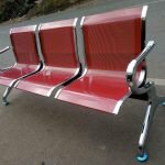 red non-padded bench, non-padded bench red, red office waiting bench, metal red bench no padding, durable red bench without cushion, red bench seating, simple red bench, red wooden non-padded bench, red seating bench without padding, red bench for reception, non-upholstered red bench, red bench with metal frame, red waiting room bench, red bench for public areas, red bench with sturdy frame, red bench for schools, red bench for hallways, red bench without upholstery, industrial red bench, basic red seating bench