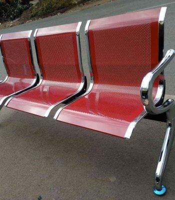 red non-padded bench, non-padded bench red, red office waiting bench, metal red bench no padding, durable red bench without cushion, red bench seating, simple red bench, red wooden non-padded bench, red seating bench without padding, red bench for reception, non-upholstered red bench, red bench with metal frame, red waiting room bench, red bench for public areas, red bench with sturdy frame, red bench for schools, red bench for hallways, red bench without upholstery, industrial red bench, basic red seating bench