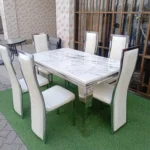 6-seater marble-top dining table, marble dining table, 6-person dining table, modern marble dining table, contemporary dining table, luxury dining table, marble tabletop dining table, dining table with marble top, solid marble dining table, rectangular marble dining table, round marble dining table, oval marble dining table, white marble dining table, black marble dining table, grey marble dining table, marble dining table with metal legs, marble dining table with wooden legs, marble dining table with steel frame, marble dining table with glass accents, minimalist marble dining table, sleek marble dining table, elegant marble dining table, designer marble dining table, premium dining table, luxury home dining table, modern home dining table, contemporary home dining table, stylish dining table, marble dining table set, 6-seater dining table set, marble dining table for kitchen, marble dining table for living room, compact marble dining table, large marble dining table, solid wood and marble dining table, marble dining table with chairs, marble dining table with bench, heavy duty marble dining table, sturdy marble dining table, commercial grade marble dining table, hotel dining table, restaurant dining table, cafe marble dining table, marble dining table for home, marble dining table for apartment, marble dining table for villa, family size dining table, 6-seater dining set, marble top table with pedestal base, marble dining table with trestle base, marble dining table with storage, marble dining table with drawers, easy clean marble table, heat resistant marble dining table, scratch resistant marble dining table, anti stain marble dining table, marble dining table with polished finish, matte finish marble dining table, natural stone dining table, premium stone dining table, high end marble dining table, classic marble dining table, contemporary marble dining room furniture, modern dining room table, stylish dining table for 6, compact dining set, multifunction dining table, marble center table dining, minimalist home dining table, marble tabletop furniture, elegant home dining solution, space saving dining table, versatile marble dining table, solid marble slab dining table, luxury marble furniture, marble table with wooden frame, marble table with metal frame, home decor dining table, sleek marble tabletop dining, durable marble dining table, high quality marble table, professional home dining furniture, marble kitchen dining table, contemporary minimalist marble table, luxury dining furniture, statement marble dining table, marble dining table for gatherings, home entertaining dining table, modern living and dining table, classic stone dining table, heavy marble dining table, premium marble dining furniture, designer home dining table, marble dining table with seating, rectangular 6-seater marble dining table, round 6-seater marble dining table, oval 6-seater marble dining table, marble dining table with sturdy base, compact 6-seater marble table, modern marble dining set, home dining room marble table, luxury marble tabletop furniture, marble dining table for family meals, sleek contemporary marble dining table, elegant stone top dining table, minimalist marble top dining table, heavy duty home dining table, solid natural marble dining table, high polished marble table, home decor marble dining furniture, versatile stone top dining table, marble dining table for open space, luxury living room dining table, designer marble dining furniture.