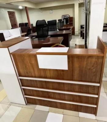 modern office reception desk, contemporary reception desk, stylish office reception desk, sleek reception desk, professional reception desk, front office reception desk, corporate reception desk, office lobby desk, receptionist desk, modern front desk, executive reception desk, minimalist reception desk, luxury reception desk, elegant reception desk, modern office front desk, reception counter, reception table, office reception furniture, reception desk with storage, reception desk with drawers, reception desk with shelves, reception desk with cabinets, reception desk with countertop, L-shaped reception desk, straight reception desk, modular reception desk, custom reception desk, designer reception desk, modern office furniture, reception area desk, office entrance desk, reception office counter, compact reception desk, large reception desk, premium reception desk, durable reception desk, sturdy reception desk, ergonomic reception desk, reception workstation, receptionist workstation, reception desk for corporate offices, reception desk for businesses, reception desk for clinics, reception desk for hospitals, reception desk for schools, reception desk for hotels, reception desk for salons, reception desk for showrooms, reception desk for studios, reception desk for co-working spaces, reception desk for banks, reception desk for law firms, reception desk for real estate offices, reception desk for tech offices, reception desk for startups, modern reception counter kenya, office reception desk kenya, reception desk nairobi, reception desk suppliers kenya, reception desk retailers kenya, reception desk shops nairobi, modern office furniture kenya, office furniture suppliers kenya, office furniture retailers kenya, executive reception desk kenya, stylish reception desk kenya, minimalist reception desk kenya, luxury reception desk kenya, elegant reception desk kenya, reception desk with modern design, reception desk with contemporary design, reception desk with clean lines, reception desk with durable material, reception desk with high-quality finish, reception desk with laminate finish, reception desk with MDF finish, reception desk with wooden finish, reception desk with metal accents, reception desk with ergonomic design, reception desk for front office staff, reception desk for receptionist comfort, reception desk for corporate image, reception desk for professional setup, reception desk for welcoming visitors, reception desk for client reception, reception desk for lobby setup, reception desk for modern office environment, reception desk for stylish interiors, reception desk for office decor, reception desk for professional appearance, reception desk for office branding, reception desk for business image, reception desk for executive offices, reception desk for high-end offices, reception desk for corporate lobbies, reception desk for reception area kenya, reception desk for front office kenya, reception desk for office reception kenya, reception desk for office entry, reception desk for visitor management, reception desk for check-in area, reception desk for service counter, reception desk for information desk, reception desk with storage cabinets, reception desk with concealed storage, reception desk with open shelves, reception desk with drawers and cabinets, reception desk with countertop space, reception desk with side return, reception desk with modular sections, reception desk with contemporary materials, reception desk with premium finish, reception desk for heavy use, reception desk for daily operations, reception desk for office workflow, reception desk for organized reception area, reception desk for clutter-free reception, reception desk for welcoming atmosphere, reception desk for professional reception area, reception desk for efficient receptionist work, reception desk for comfort and style, reception desk for modern interiors kenya, reception desk for office renovation, reception desk for new office setup, reception desk for office upgrade, reception desk for office furnishing, reception desk for front office interior, reception desk for office lobby design, reception desk for corporate aesthetics, reception desk for elegant office look, reception desk for stylish office furniture, reception desk for durable office furniture, reception desk for premium office furniture, reception desk for professional office setup, reception desk for executive office design, reception desk for modern workspaces, reception desk for contemporary office, reception desk for high-quality office furniture, reception desk for reception area design kenya, reception desk for corporate branding kenya, reception desk for office image kenya, reception desk for business environment kenya, reception desk for office furniture suppliers nairobi, reception desk for office furniture shops kenya, reception desk for office furniture showrooms kenya, reception desk for office furniture dealers kenya, reception desk for office furniture distributors kenya, reception desk for office furniture manufacturers kenya, reception desk for office furniture importers kenya, reception desk for office furniture exporters kenya, reception desk for office furniture buyers kenya, reception desk for office furniture sellers kenya, reception desk for office furniture market kenya, reception desk for office furniture trade kenya, reception desk for office furniture commerce kenya, reception desk for office furniture online kenya, reception desk for office furniture ecommerce kenya, reception desk for office furniture website kenya, reception desk for office furniture listing kenya, reception desk for office furniture catalog kenya, reception desk for office furniture inventory kenya, reception desk for office furniture stock kenya, reception desk for office furniture supply kenya, reception desk for office furniture demand kenya, modern reception desk kenya, contemporary office desk kenya, stylish office desk kenya, sleek office desk kenya, executive reception desk kenya,